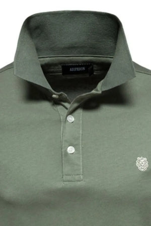 Moss green cotton polo shirt with embroidered crest detail and button placket.