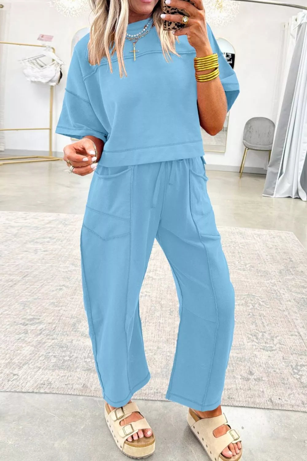 Blue cotton crew neck boxy tee and relaxed barrel pants set with drawstring waist and pockets.