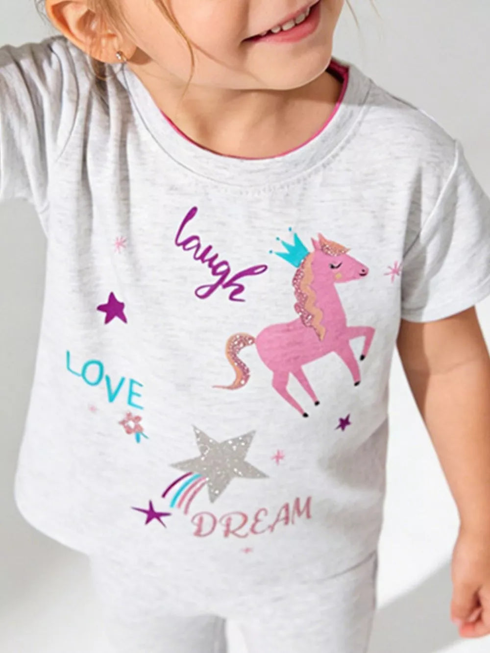 Toddler grey crew neck t-shirt with pink unicorn, crown, stars, and text graphics.