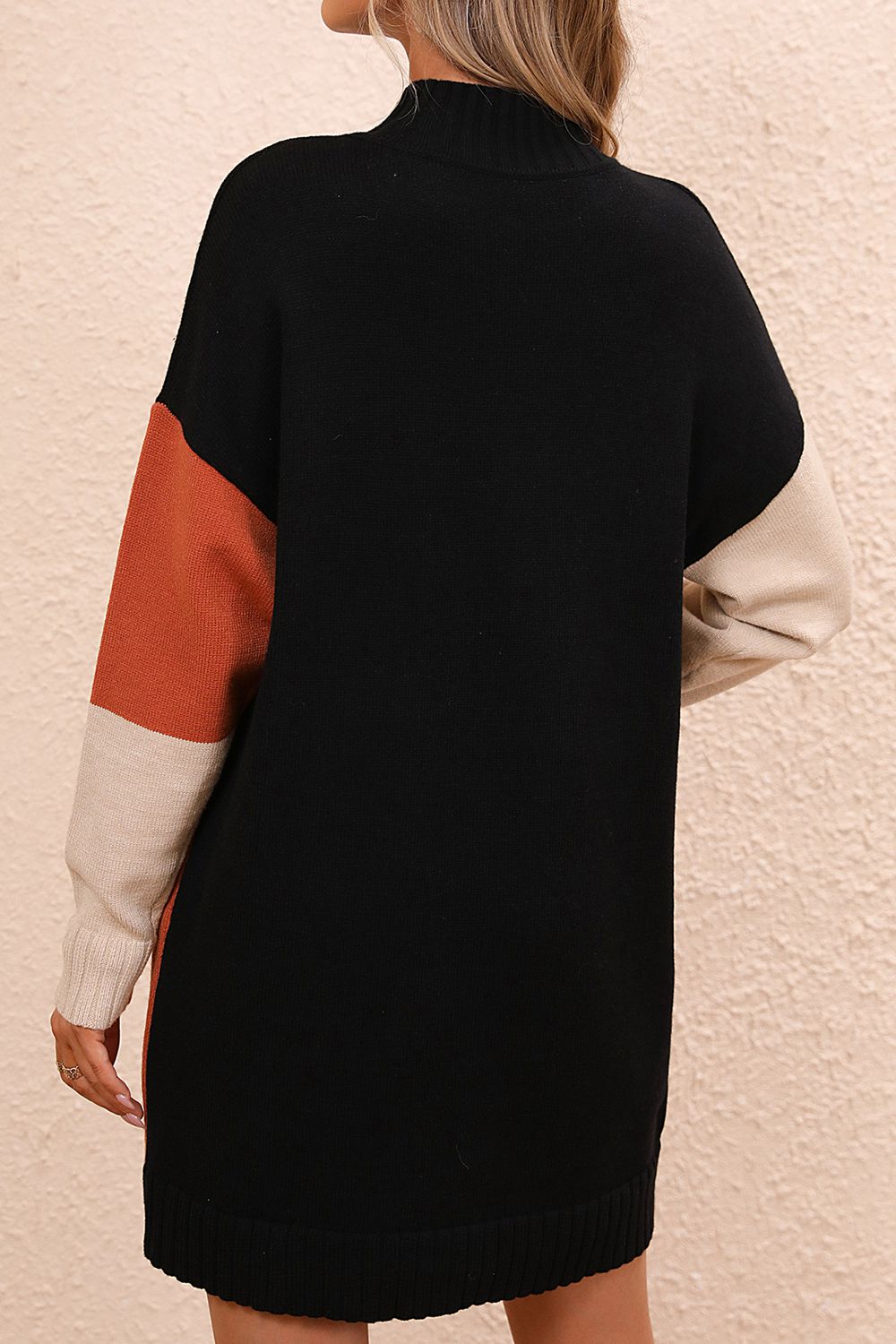 Geometric colorblock knit mini dress with black, camel, and ivory colorblocking.