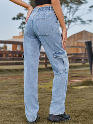 Light wash denim straight leg cargo pants with elastic waistband and multiple pockets.