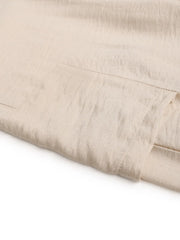 Chic waist-tie flare trousers in tan, showing pocket detail and textured fabric.