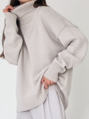 Relaxed roll-neck sweater in light gray, featuring a boxy knit and ribbed cuffs and hem.