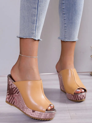 Textured wedge mules with open toe in tan, featuring a patterned wedge heel.