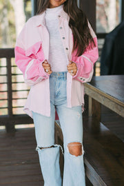 Colorblock corduroy shacket in blush pink with raw edges and button front.
