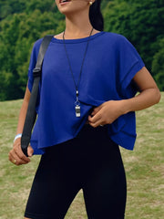 Royal blue t-shirt with exposed seams and cutout back detail.