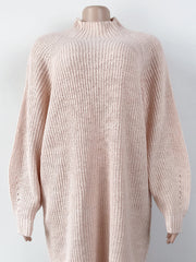 Blush pink ribbed knit cocoon turtleneck dress with long sleeves and a relaxed fit.