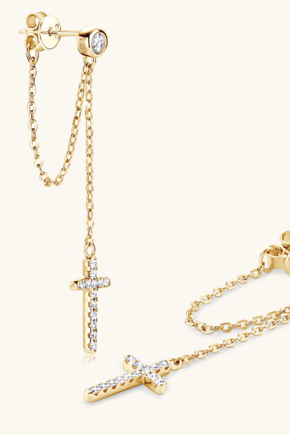 Gold dangling cross chain stud earrings with clear stones