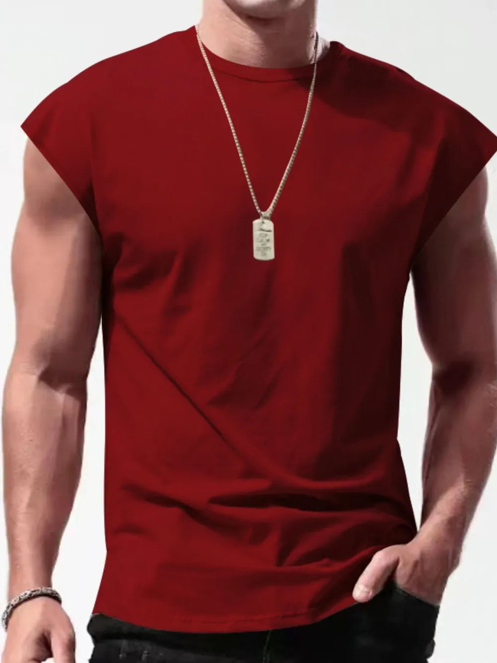 Burgundy muscle-fit sleeveless tee with wide shoulders, crew neck, and a dog tag necklace.