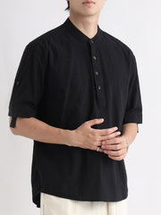 Black band collar button-down shirt with rolled sleeves.