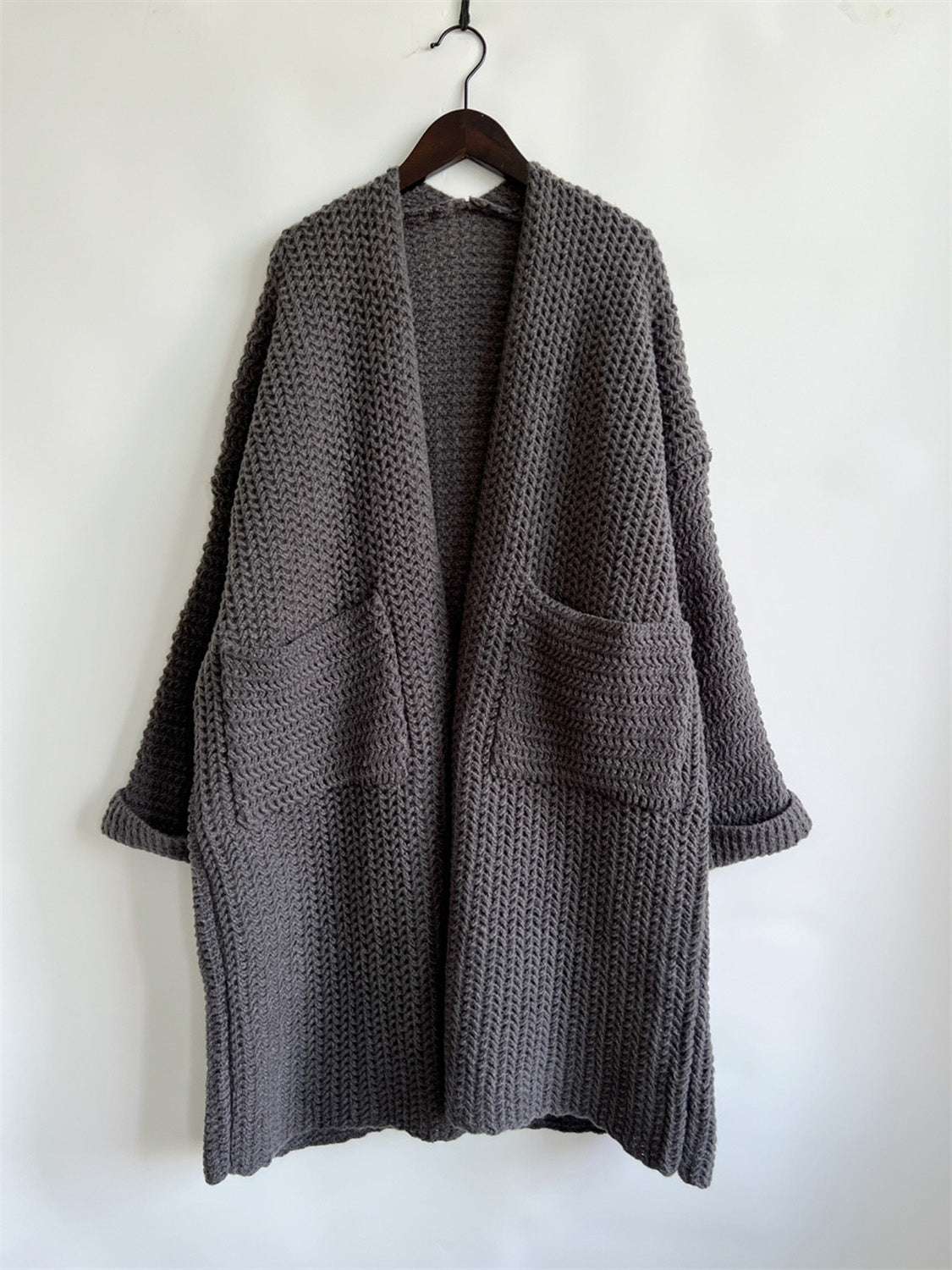 Chunky knit cocoon cardigan coat in charcoal with open front and patch pockets.