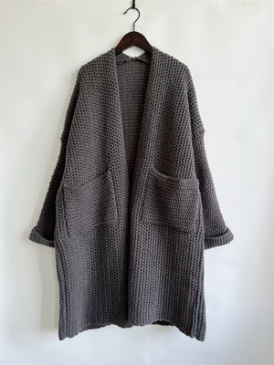 Chunky knit cocoon cardigan coat in charcoal with open front and patch pockets.