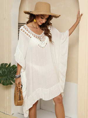 Ivory crochet yoke ruffle hem cover-up with V-neck and short sleeves.