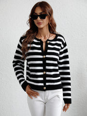 Black and white striped knit cardigan with button front and pockets.