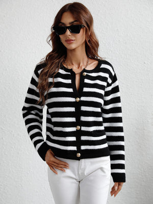 Black and white striped knit cardigan with button front and pockets.