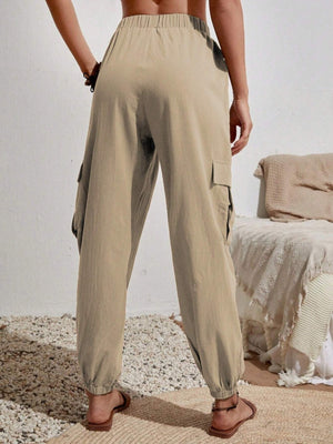 Khaki cargo lounge trousers with elastic waist and cuffs, featuring side cargo pockets.