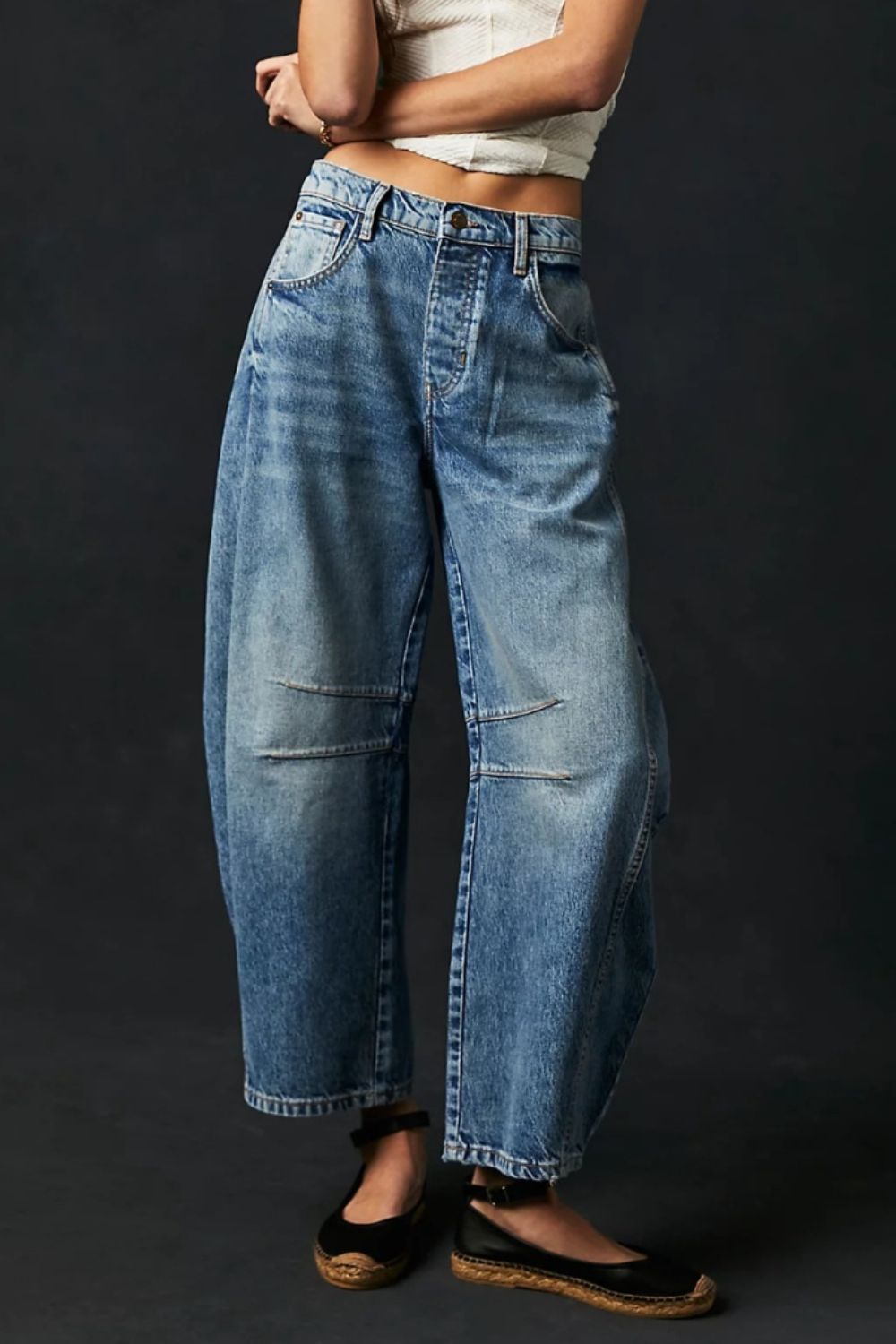 Light blue denim barrel leg jeans with button fly and knee panel detail