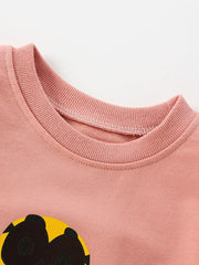 Dusty pink cotton sweatshirt with owl graphic detail and ribbed neckline.