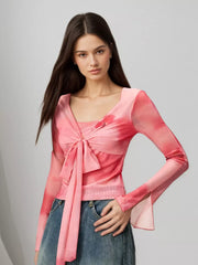 Watercolor tie-front t-shirt with flared sleeves in pink, featuring a V-neck and long sleeves.