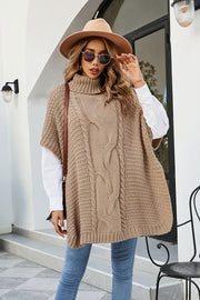 Camel cable knit turtleneck poncho with side slit, acrylic.
