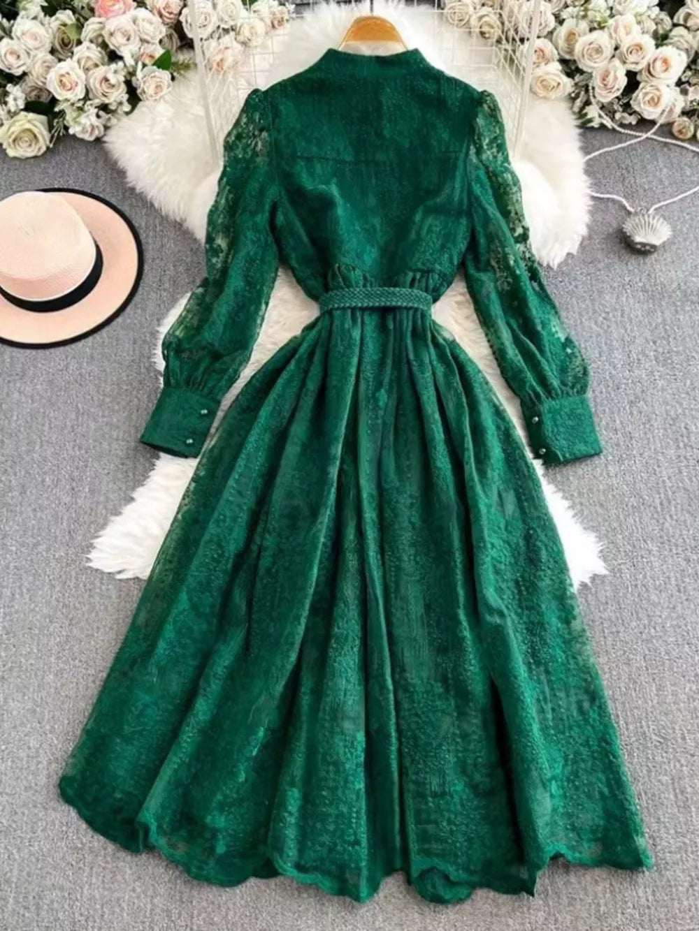 Green lace maxi dress with tie waist, button cuffs and balloon sleeves.