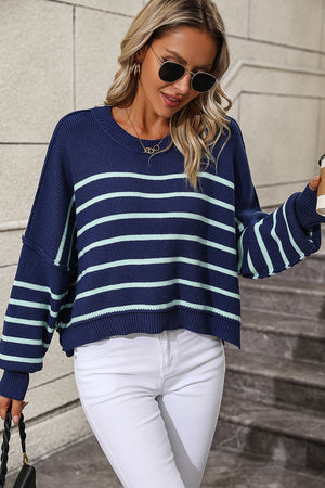 Navy and aqua striped boxy knit sweater with crew neck and drop shoulders.