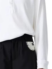 Men's black wide-leg trousers with a patterned pocket detail.