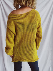 Mustard open-knit slouchy boatneck pullover sweater with ribbed texture and wide neckline.