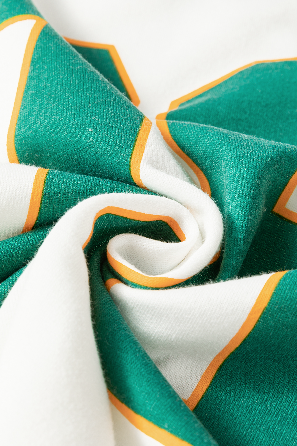White raglan sweatshirt with green and orange varsity-inspired graphic detail