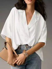 White V-neck half sleeve shirt with a relaxed fit and textured fabric.