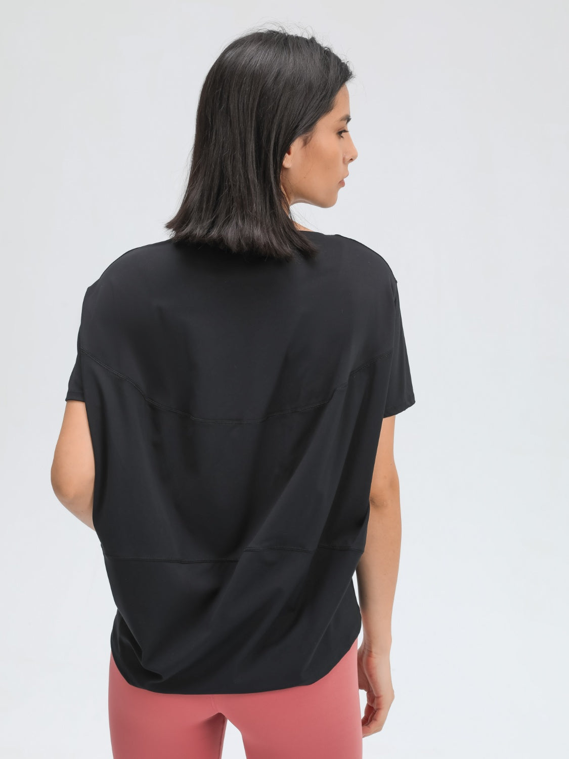 Black relaxed fit performance tee with short sleeves and a crew neck.