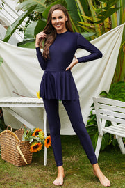 Navy blue long sleeve swimsuit with flounce hem and leggings