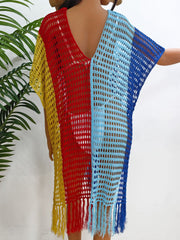 Colorblock crochet cover-up with fringe in yellow, red, and blue.