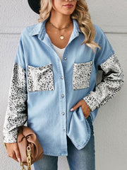 Denim shirt with leopard print sleeves and pockets, button-up, casual style.