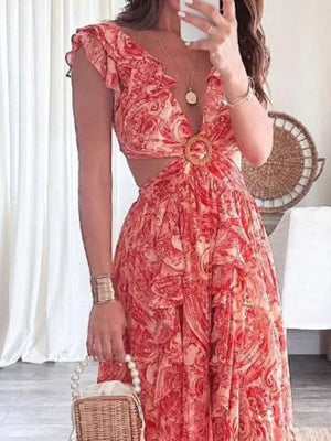 Elegant ruffled V-neck maxi dress in pink paisley print with cut-outs and a wooden ring detail.