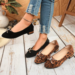 Black and leopard print block heels with bows and gold accents
