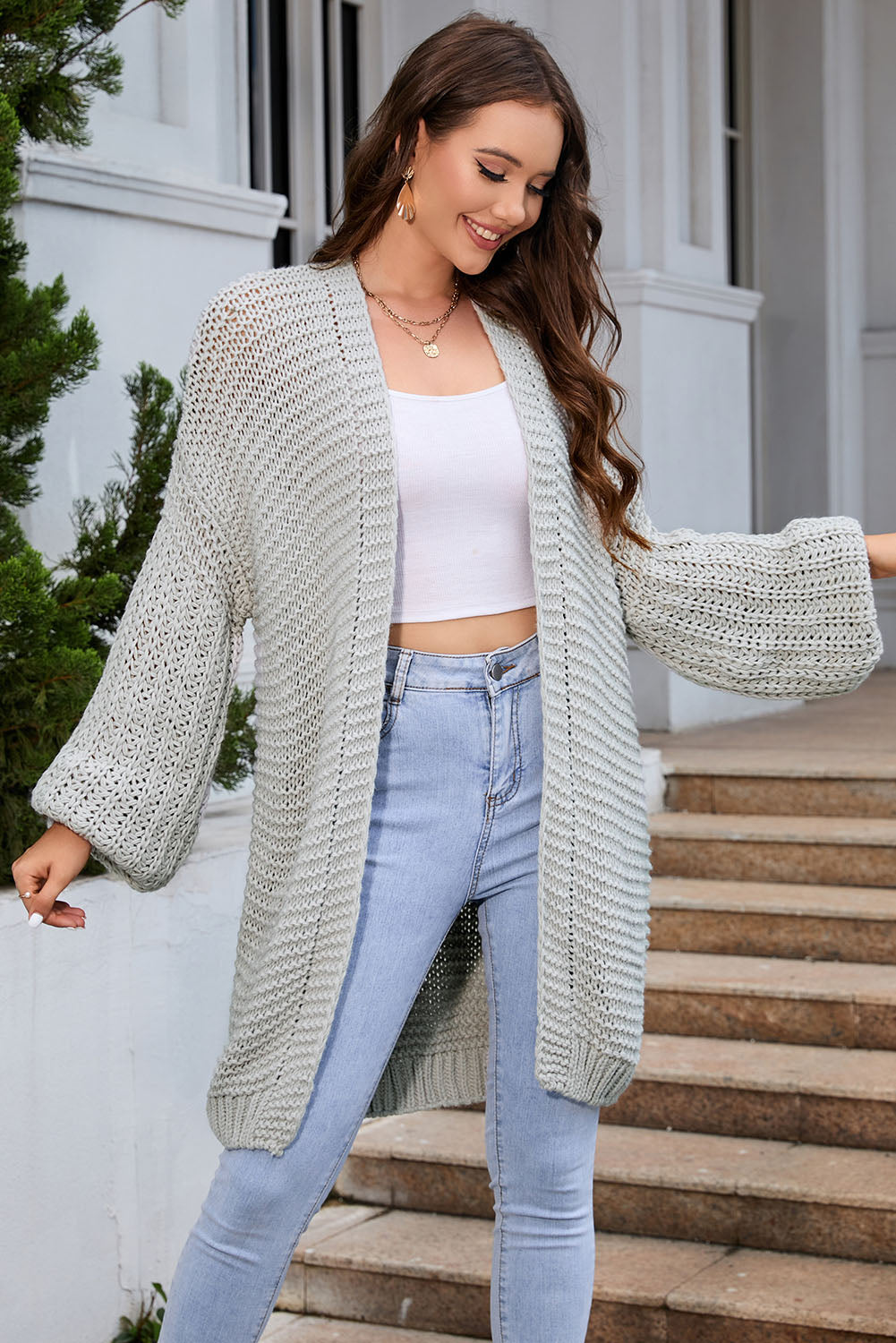 Light Gray textured knit cocoon cardigan with balloon sleeves and open front.