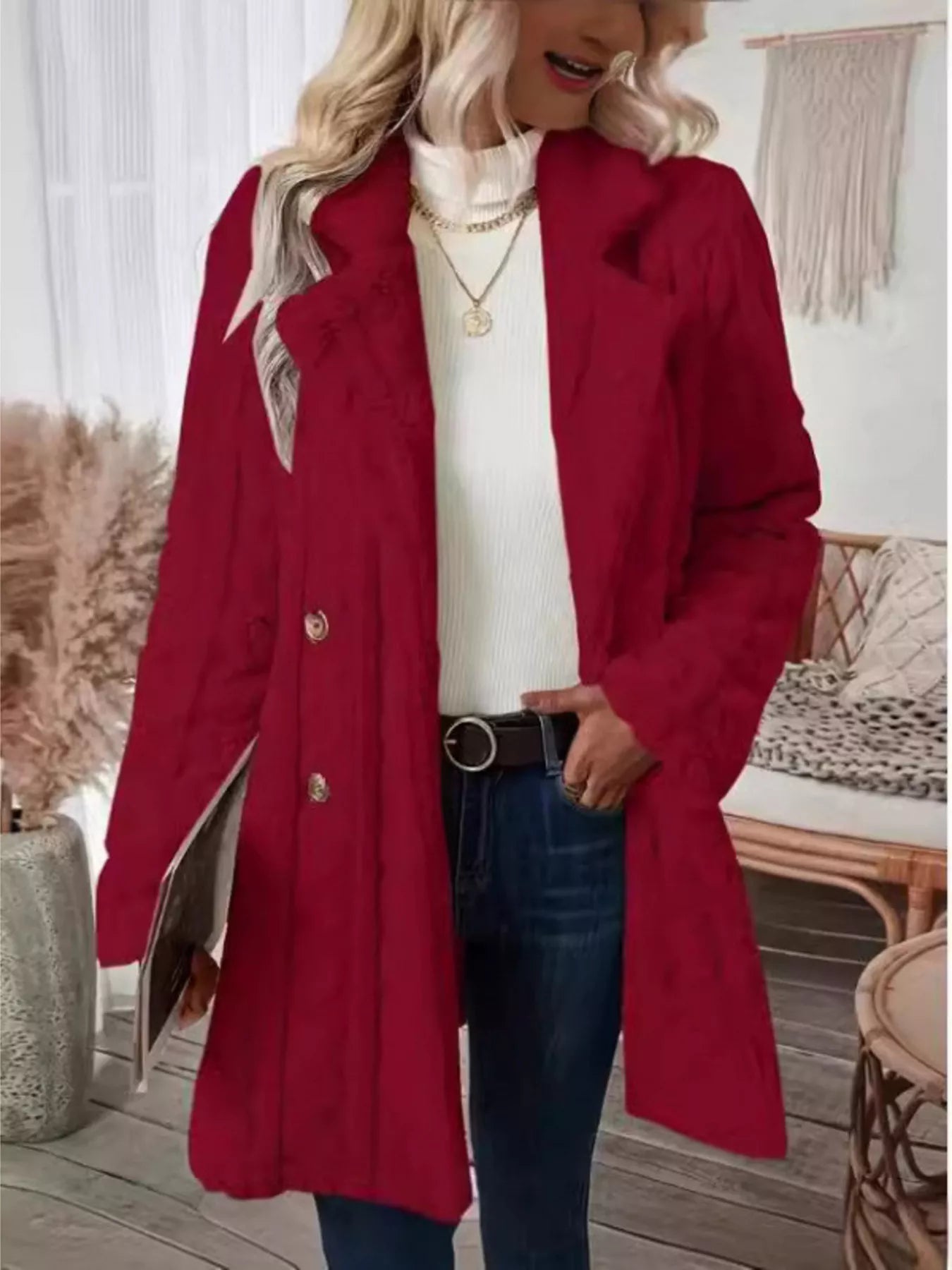 Red faux shearling double-breasted overcoat with gold buttons and a notched lapel.