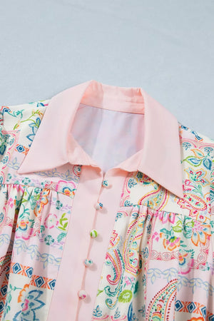 Floral patchwork mini dress with pink collar and button-down front.