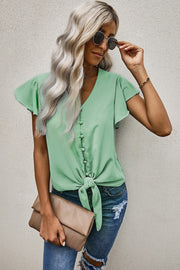 Gum Leaf button-down tie-front blouse with ruffle sleeves and V-neck.
