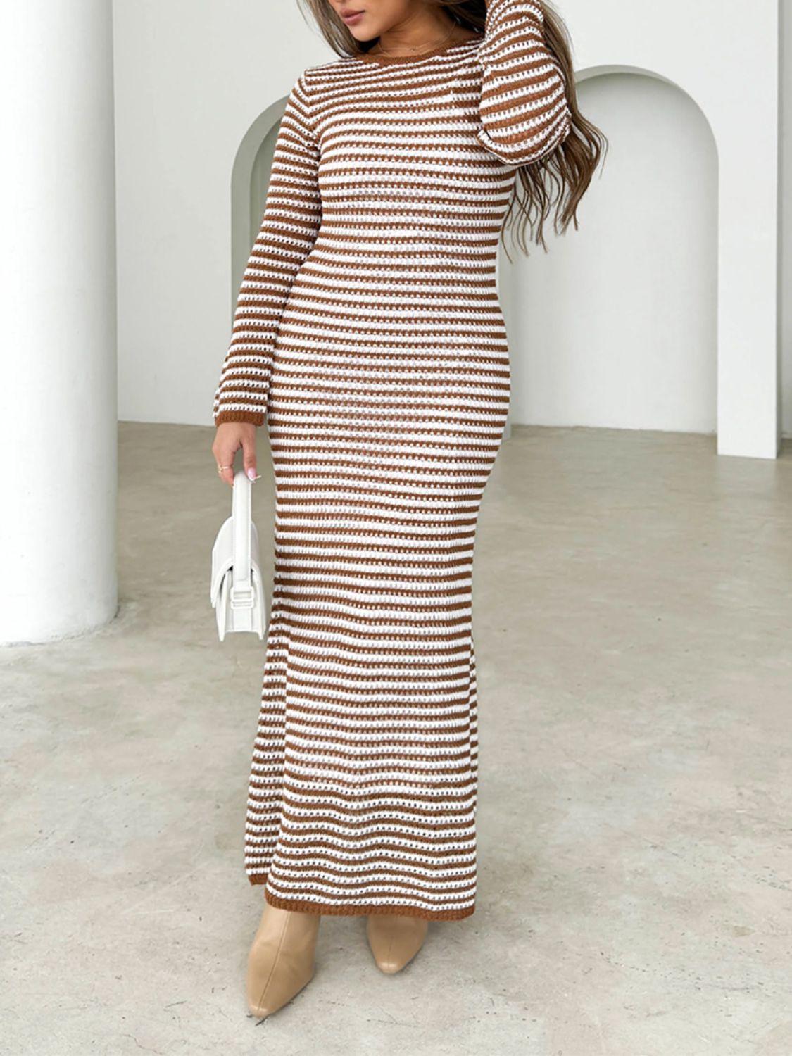 Striped maxi sweater dress in caramel and white with long sleeves and a back tie detail.