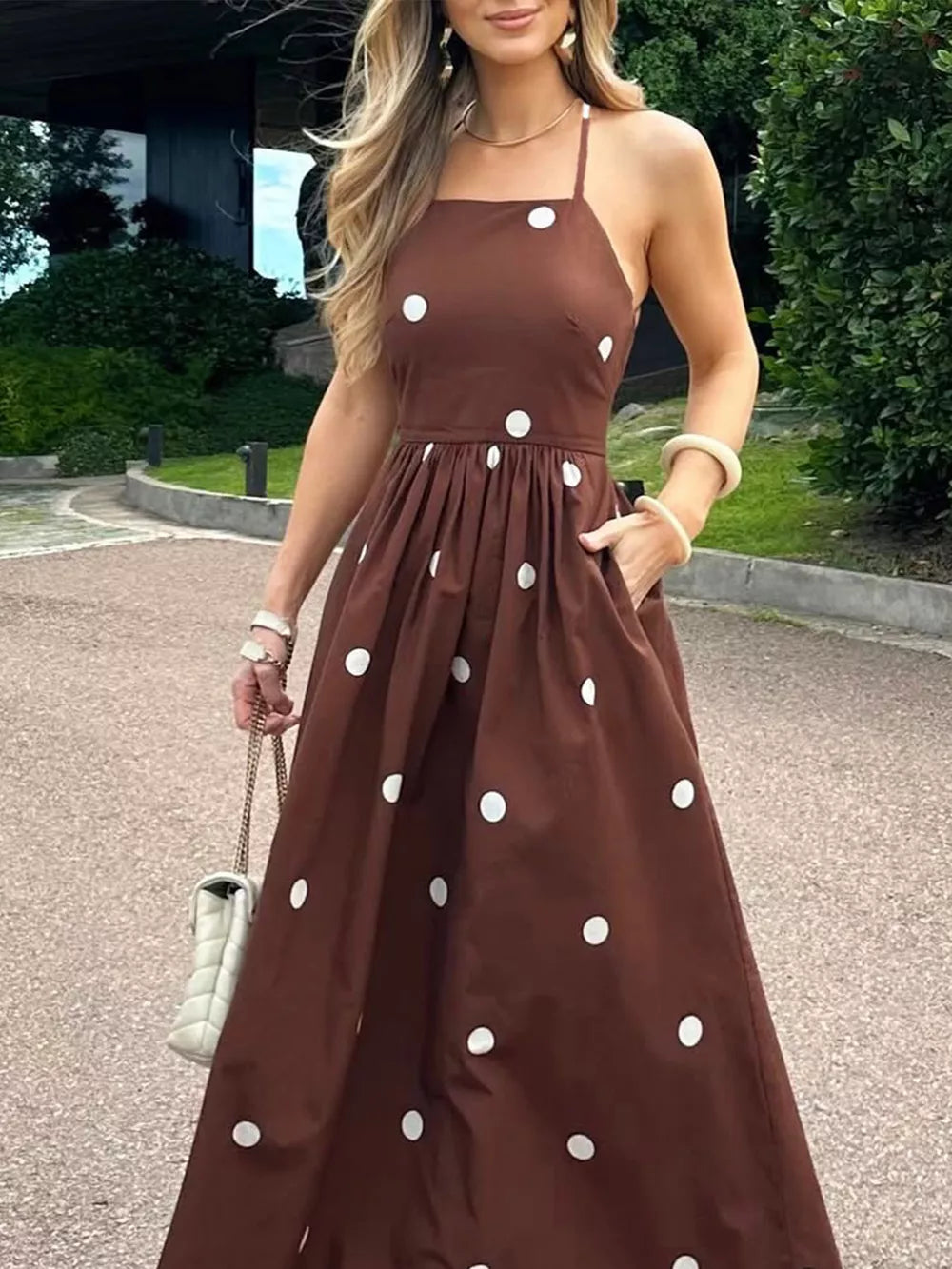 Brown polka dot maxi dress with pockets and square neckline.