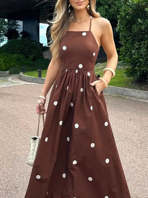 Brown polka dot maxi dress with pockets and square neckline.