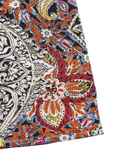 Paisley print midi dress with tie neck, featuring a vibrant floral pattern in red, orange, yellow, and blue.