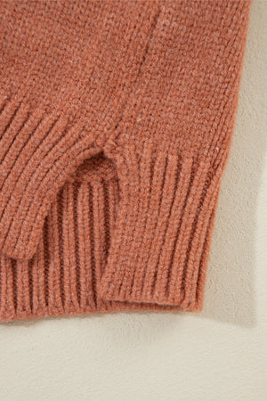 Open-front cropped knit cardigan in burnt coral acrylic with ribbed details.