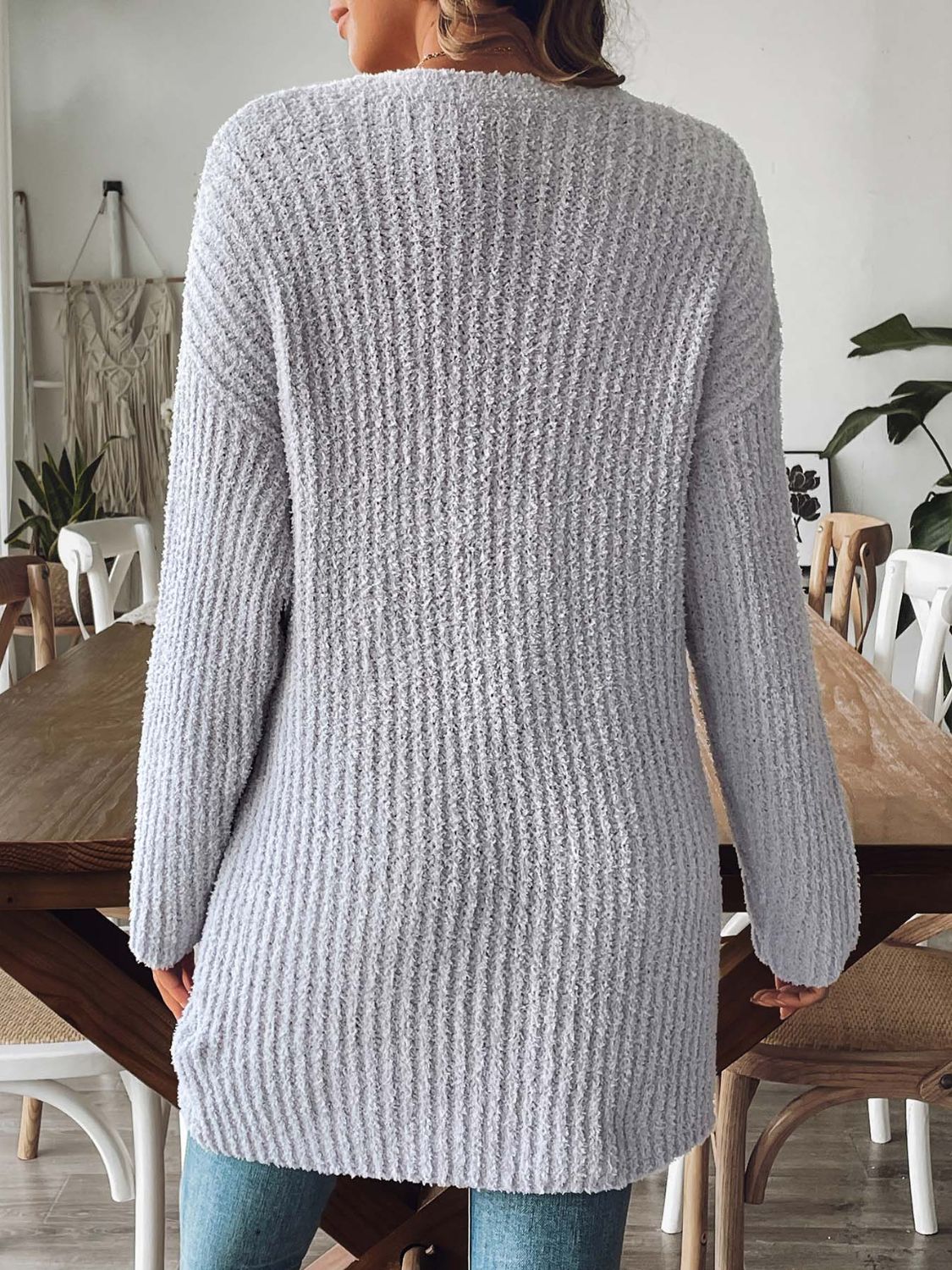Gray textured bouclé open-front cardigan with long sleeves and a relaxed fit.