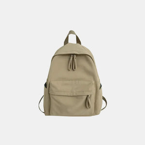 Khaki canvas school backpack with dual front pockets and zipper closure.