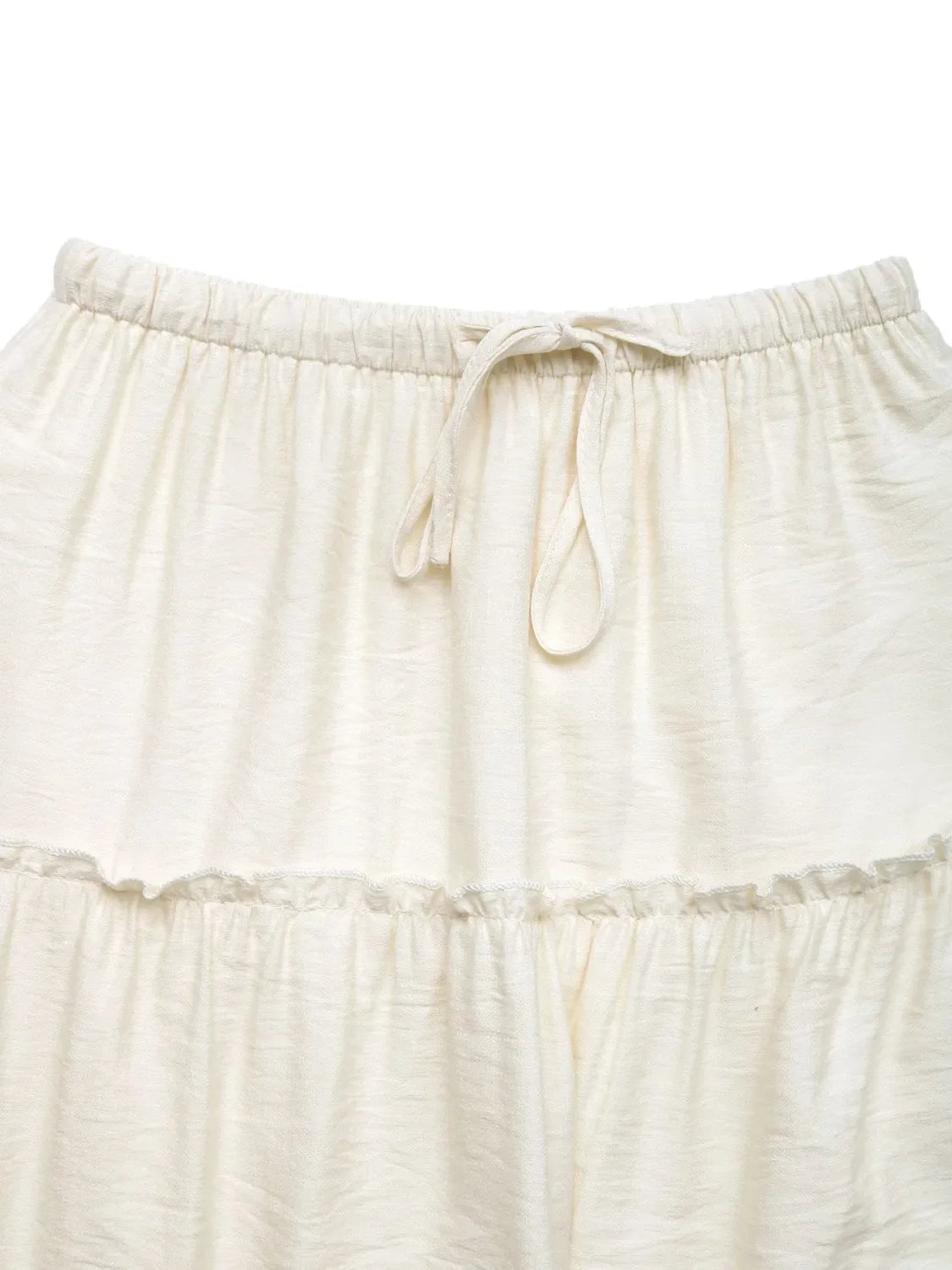 Cream tiered midi skirt with drawstring waist and ruffled seams