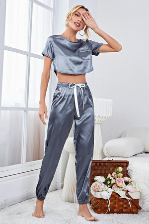 Steel satin crop top and jogger set with white drawstring and chest pocket.