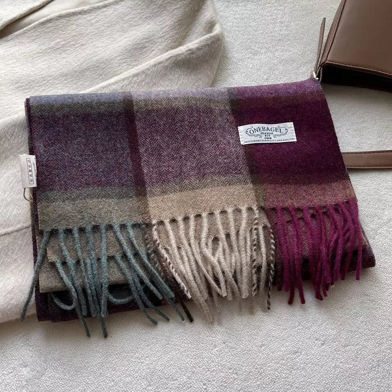 Classic wool plaid scarf with tassels in burgundy, mauve, and khaki tones.